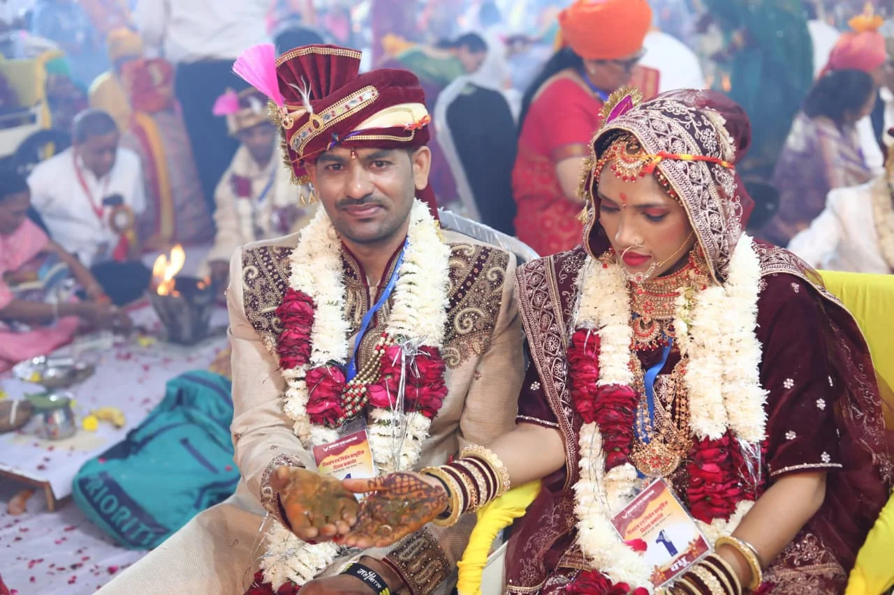 Newlywed couples at mass wedding ceremony